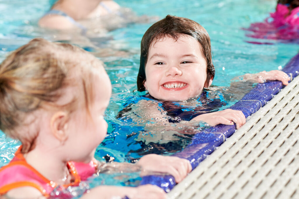 children learning to stay safe while swimming
